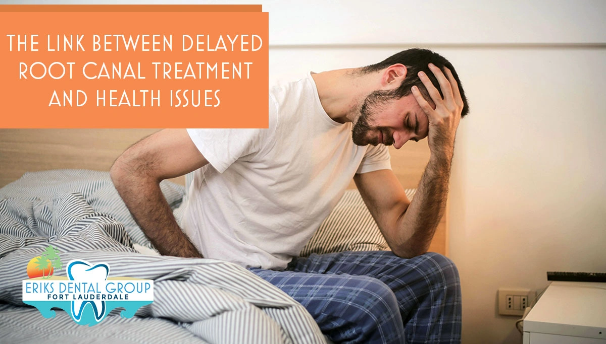 man sitting on the side of his bed, hunched over with his hand on his head
