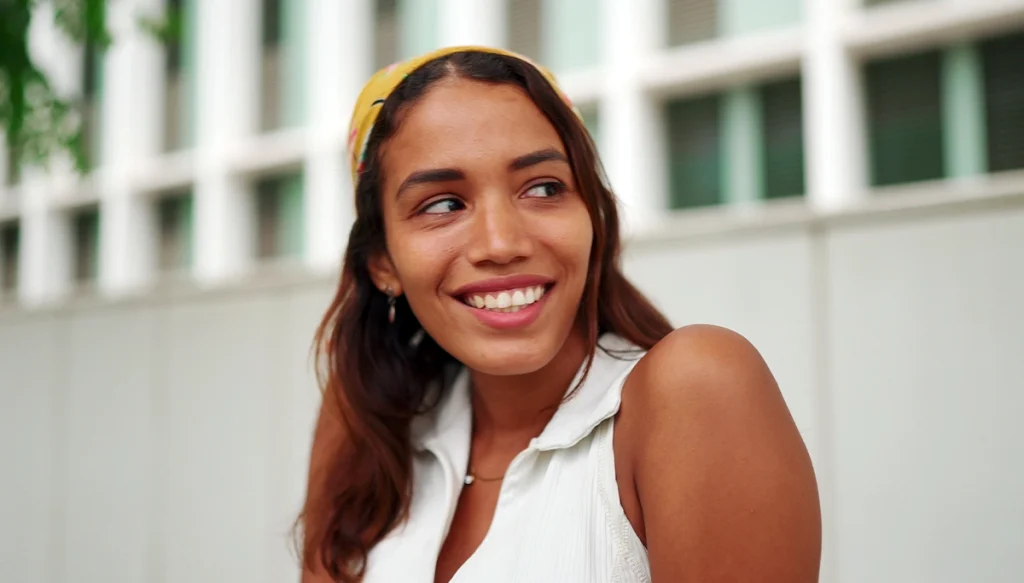 smiling woman wearing a bandana 