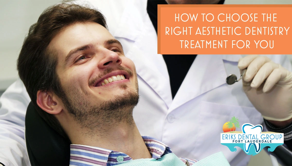 bearded man sitting in dentist chair while smiling