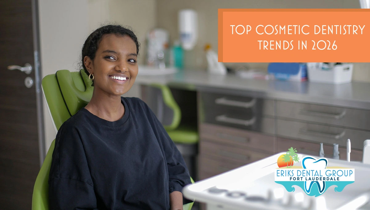 young woman smiling while sitting in a dentist chair