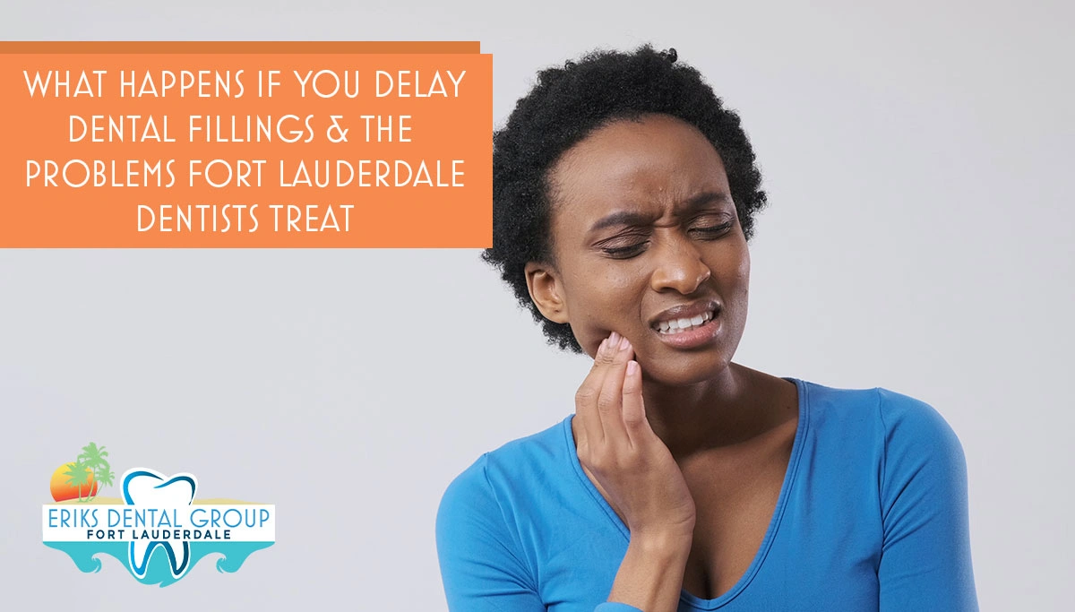 Woman holding cheek, gritting teeth and eyes tightly closed